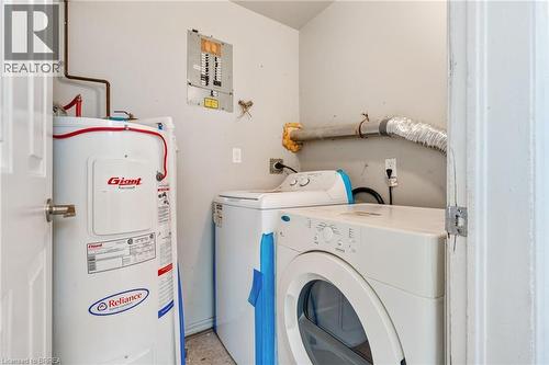 Dedicated utility space featuring a water heater, electrical panel, and dryer vent - 9 Cherry Street, Simcoe, ON - Indoor Photo Showing Laundry Room
