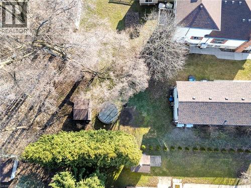 Spacious lot featuring mature trees, a storage shed, and areas of manicured lawn - 9 Cherry Street, Simcoe, ON - Outdoor