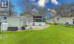 Rear view of home with garden shed - 