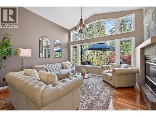 3929 Gallaghers Circle, Kelowna, BC - Indoor Photo Showing Living Room With Fireplace