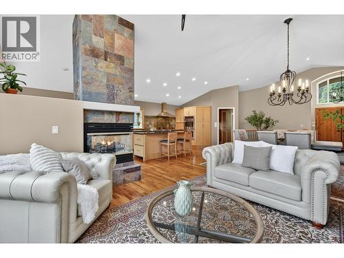 3929 Gallaghers Circle, Kelowna, BC - Indoor Photo Showing Living Room With Fireplace