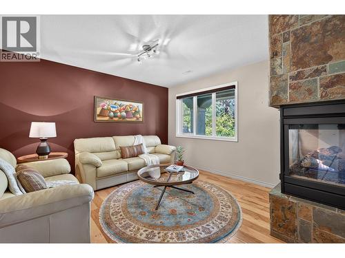 3929 Gallaghers Circle, Kelowna, BC - Indoor Photo Showing Living Room With Fireplace