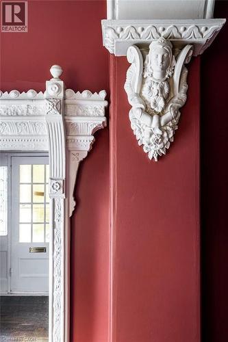 Decorative plaster corbel and ornate door frame showcasing detailed craftsmanship - 370 Hess Street S, Hamilton, ON - 