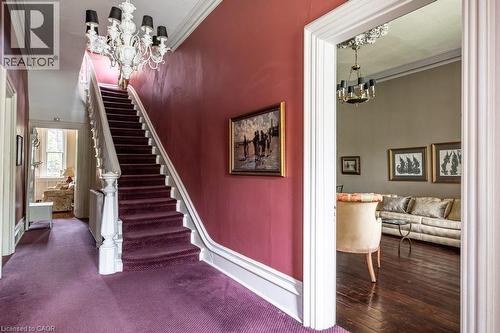 Grandiose staircase featuring a white carved banister and purple carpet - 370 Hess Street S, Hamilton, ON - Indoor Photo Showing Other Room