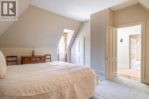Attic bedroom featuring pitched ceilings and light-toned carpeting - 370 Hess Street S, Hamilton, ON - Indoor Photo Showing Bedroom