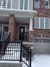 Brick and siding exterior featuring white-framed windows - 50 Emick Drive, Ancaster, ON  - Outdoor 