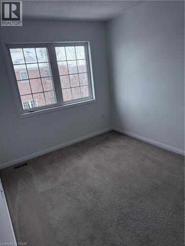 Double-paned window with decorative muntins and a white frame - 50 Emick Drive, Ancaster, ON - Indoor Photo Showing Other Room