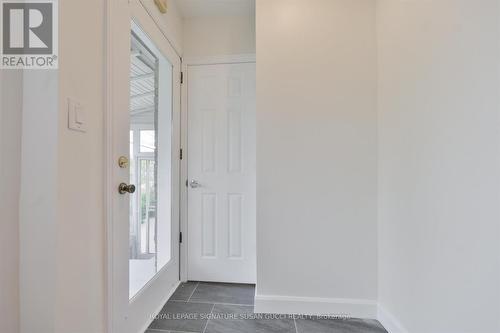 Door to closed off sun filled front porch - 388 O'Connor Drive, Toronto, ON - Indoor Photo Showing Other Room