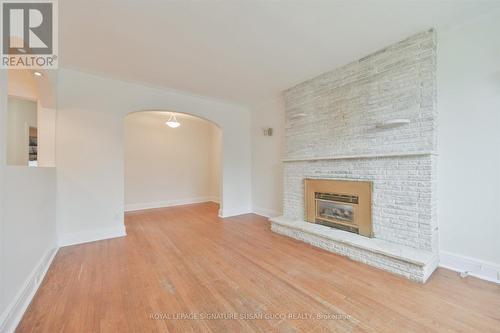 Spacious living room bright and welcoming - 388 O'Connor Drive, Toronto, ON - Indoor Photo Showing Living Room With Fireplace