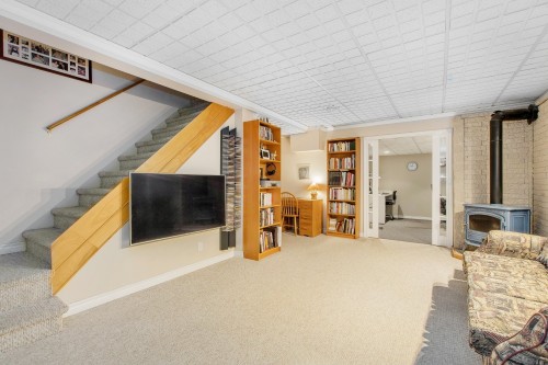 Salle familiale - 425 Rue Perras, Laval (Auteuil), QC - Indoor Photo Showing Other Room With Fireplace