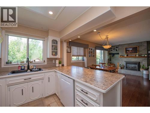 3701 15 Avenue, Vernon, BC - Indoor Photo Showing Kitchen With Fireplace