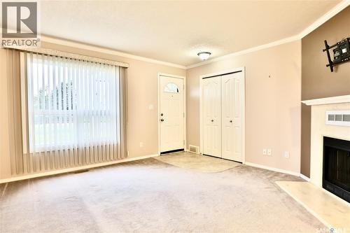 220 Cedar Meadow Drive, Regina, SK - Indoor Photo Showing Other Room With Fireplace