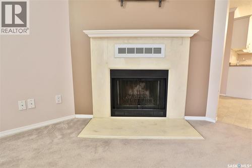 220 Cedar Meadow Drive, Regina, SK - Indoor Photo Showing Living Room With Fireplace