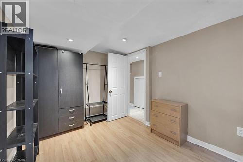 Neutral-toned walls complement the wood-finish flooring - 738 King Street W, Hamilton, ON - Indoor Photo Showing Other Room