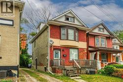 Brick exterior with bay window feature, dormer, and front porch - 