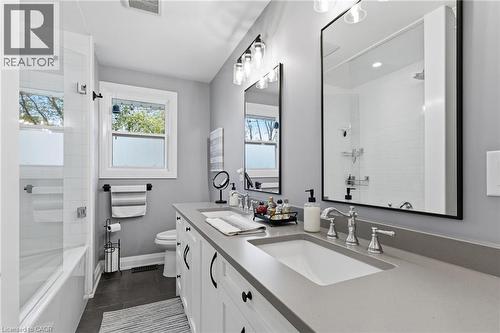 Dual basin vanity with undermount sinks and contemporary chrome fixtures - 2116 Binbrook Road E, Hamilton, ON - Indoor Photo Showing Bathroom