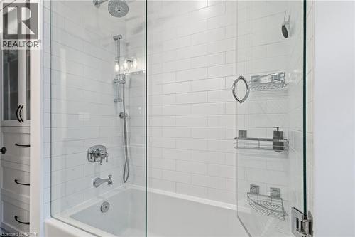 Subway tile surround with a built-in bathtub and glass shower enclosure - 2116 Binbrook Road E, Hamilton, ON - Indoor Photo Showing Bathroom