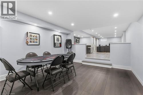 Lower level featuring wood-finish flooring, recessed lighting, and a half-wall partition - 2116 Binbrook Road E, Hamilton, ON - Indoor Photo Showing Dining Room