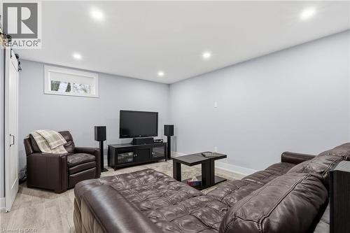 Finished lower level featuring recessed lighting, light gray wall paint, and wood-finish flooring - 2116 Binbrook Road E, Hamilton, ON - Indoor Photo Showing Other Room