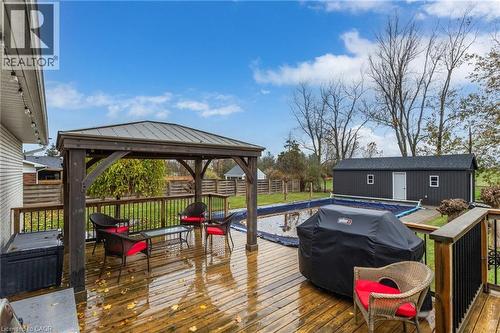 Expansive wood-finish deck with a built-in gazebo and metal roof - 2116 Binbrook Road E, Hamilton, ON - Outdoor With Deck Patio Veranda
