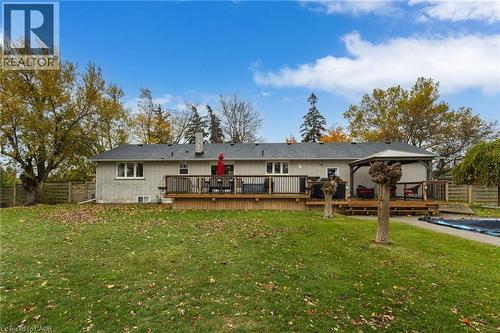 Expansive rear yard featuring a multi-level wood deck, a covered gazebo, and an in-ground pool - 2116 Binbrook Road E, Hamilton, ON - Outdoor With Deck Patio Veranda With Backyard