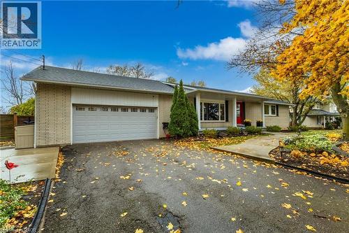 Brick and siding exterior with a two-car garage - 2116 Binbrook Road E, Hamilton, ON - Outdoor With Facade
