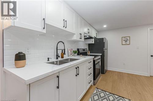 487 East 37Th Street, Hamilton, ON - Indoor Photo Showing Kitchen With Double Sink