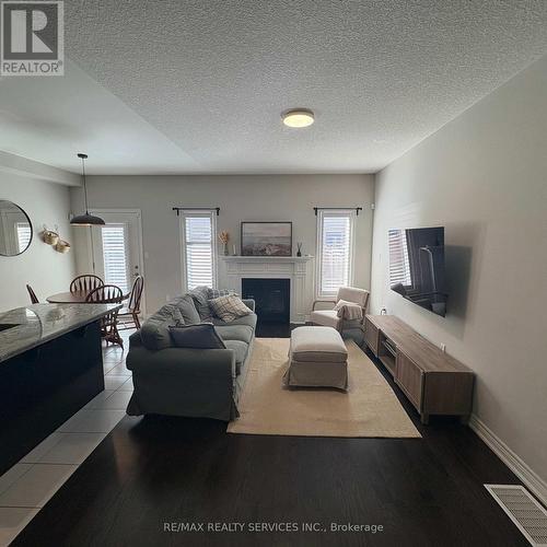 7 Sonoma Valley Crescent, Hamilton, ON - Indoor Photo Showing Living Room With Fireplace