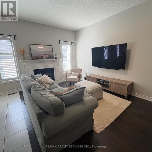 7 Sonoma Valley Crescent, Hamilton, ON - Indoor Photo Showing Living Room With Fireplace