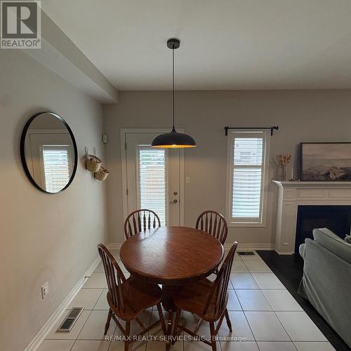 7 Sonoma Valley Crescent, Hamilton, ON - Indoor Photo Showing Dining Room With Fireplace