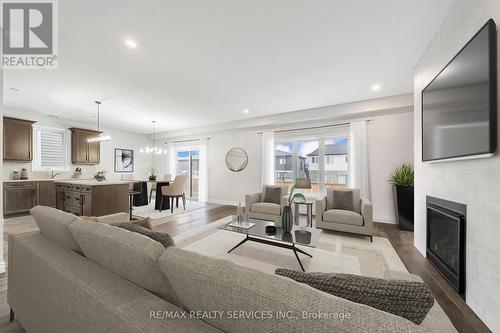 1891 Fountain Grass Drive, London South, ON - Indoor Photo Showing Living Room With Fireplace