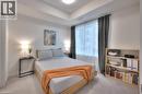 Neutral-toned bedroom featuring a prominent window, recessed ceiling, and light-colored carpeting - 247 Northfield Drive E Unit# 207, Waterloo, ON  - Indoor Photo Showing Bedroom 