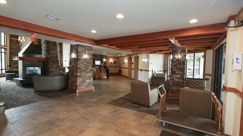 318-400 Stemwinder Drive, Kimberley, BC - Indoor Photo Showing Other Room With Fireplace