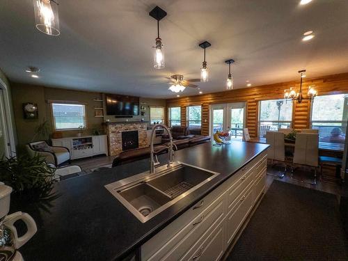 162 Hidden Trail Road, Kenora, ON - Indoor Photo Showing Kitchen With Fireplace With Double Sink