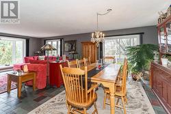 Dining and living room with walkout to side deck - 