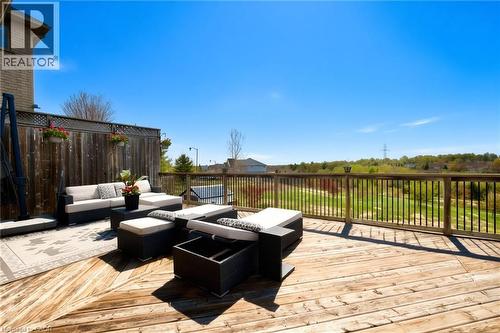 Expansive wood-finish deck with a wooden railing and a privacy fence - 704 Zurich Drive, Waterloo, ON - Outdoor With Deck Patio Veranda With Exterior
