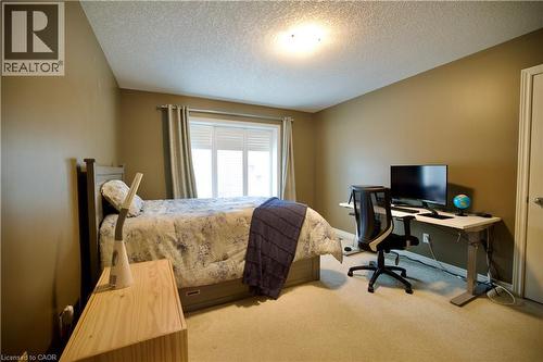 Carpeted bedroom with neutral wall tones - 704 Zurich Drive, Waterloo, ON - Indoor Photo Showing Bedroom
