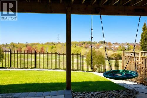 Rear patio featuring a paver stone surface and perimeter gravel landscaping - 704 Zurich Drive, Waterloo, ON - 