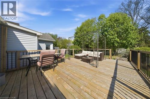 Expansive wood deck with wood plank flooring and dark wood railings - 401 West Street, Simcoe, ON - Outdoor With Deck Patio Veranda With Exterior