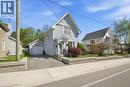 Light blue siding exterior with white trim - 401 West Street, Simcoe, ON  - Outdoor With Facade 