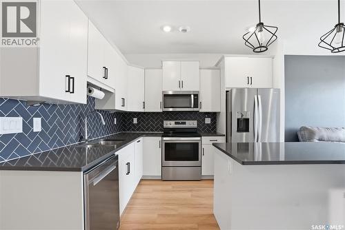 309 105 Willis Crescent, Saskatoon, SK - Indoor Photo Showing Kitchen With Double Sink With Upgraded Kitchen