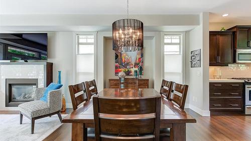 1-1865 Begbie Road, Kelowna, BC - Indoor Photo Showing Dining Room With Fireplace