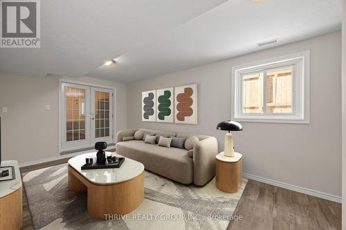 This photo has been virtually staged - 2 - 329 Thompson Road, London South (South I), ON - Indoor Photo Showing Living Room