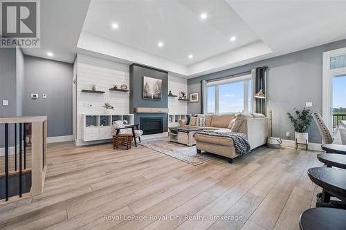 50 Faith Drive, Mapleton, ON - Indoor Photo Showing Living Room With Fireplace