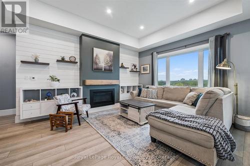 50 Faith Drive, Mapleton, ON - Indoor Photo Showing Living Room With Fireplace