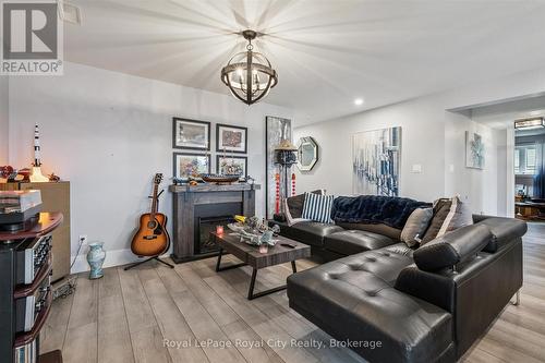 50 Faith Drive, Mapleton, ON - Indoor Photo Showing Living Room With Fireplace
