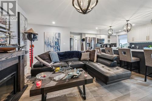 50 Faith Drive, Mapleton, ON - Indoor Photo Showing Living Room With Fireplace