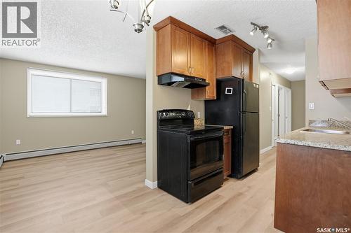 106 254 Pinehouse Place, Saskatoon, SK - Indoor Photo Showing Kitchen With Double Sink
