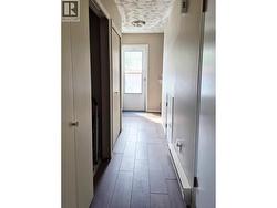 Hallway back to back door and to the left is where the laundry hook ups are. - 