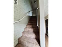 Stairs to second level, top floor - 